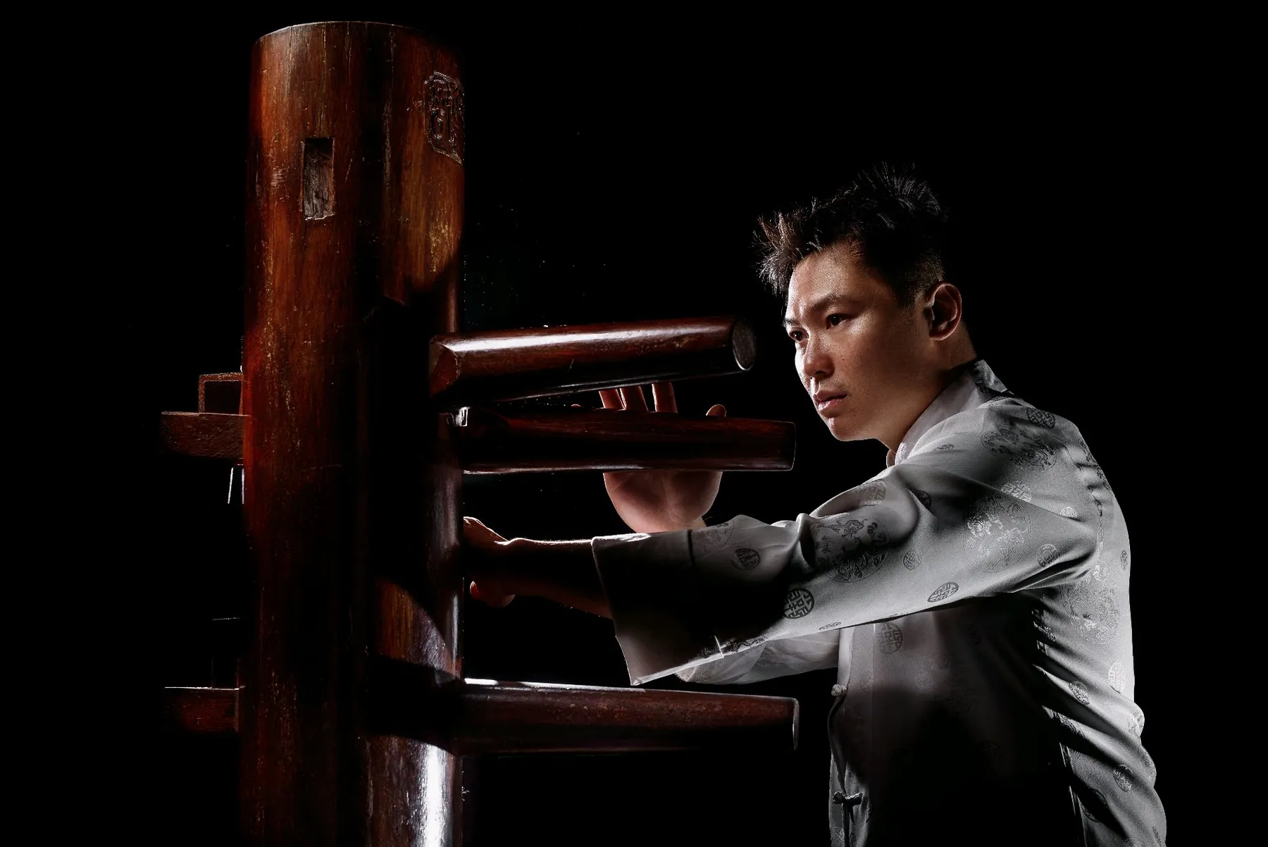 Master Leo Au-Yeung training on a Wing Chun wooden dummy