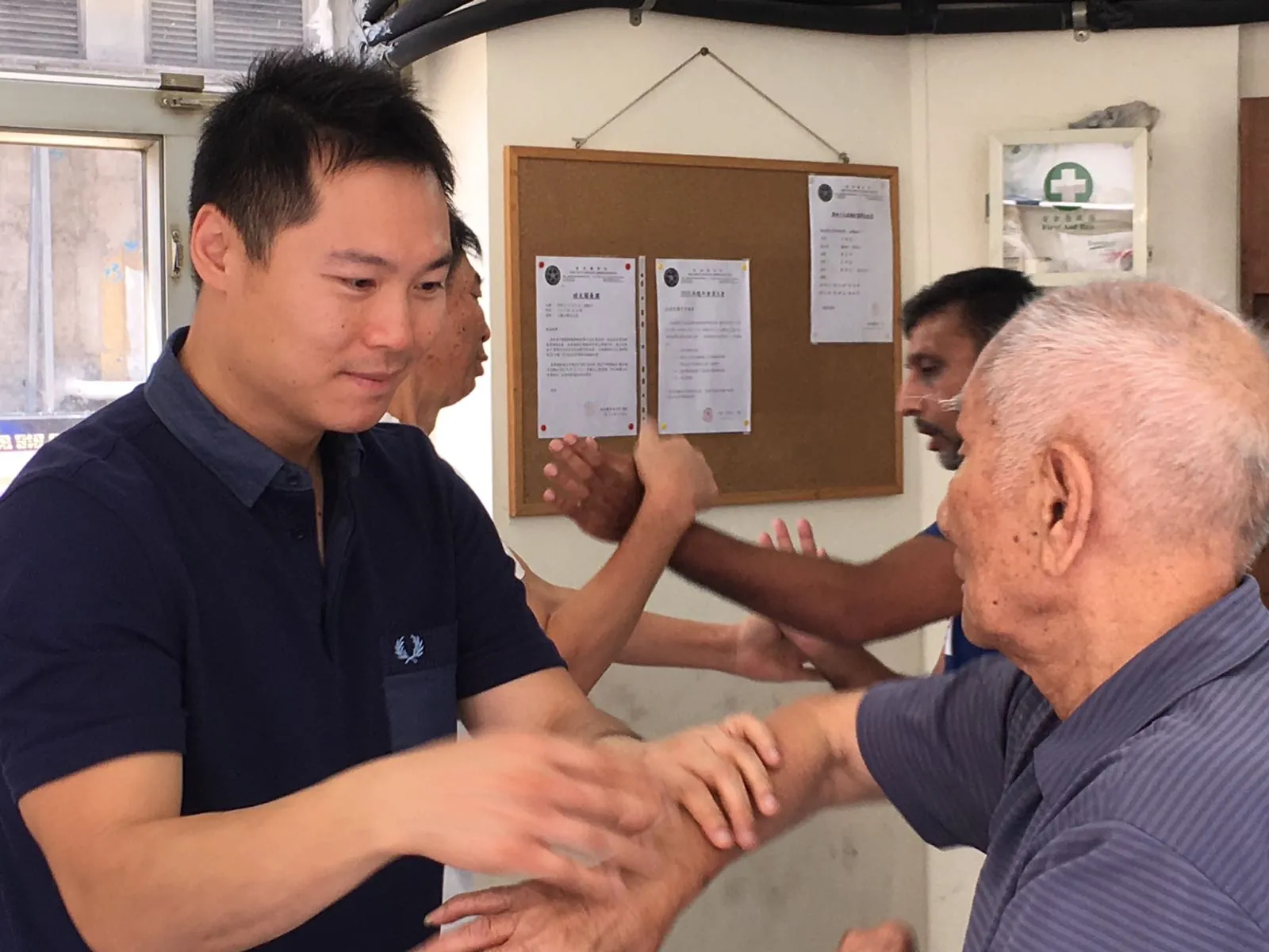 Master Leo Au-Yeung practising Chi Sau in Hong Kong while students train alongside